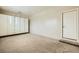 Bright garage featuring built in white cabinets and an exterior door for added convenience at 8318 Sonora Del Sol St, Las Vegas, NV 89113