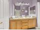 Bathroom with double sink vanity, granite countertop, and large mirror at 10001 Peace Way # 2277, Las Vegas, NV 89147