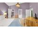 Spacious bedroom with lavender walls, walk-in closet, ensuite access, and bright natural light at 10001 Peace Way # 2277, Las Vegas, NV 89147