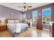 Bedroom with a bed, desk, dresser and 3 large windows at 10001 Peace Way # 2277, Las Vegas, NV 89147
