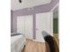Bright bedroom with neutral walls and wood-style laminate floors at 10001 Peace Way # 2277, Las Vegas, NV 89147