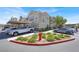 Apartment building exterior with carports and well-maintained landscaping on a sunny day at 10001 Peace Way # 2277, Las Vegas, NV 89147