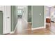 Hallway with laminate floors connecting various rooms, including a dining area and bedroom space at 10001 Peace Way # 2277, Las Vegas, NV 89147