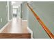Hallway featuring laminate flooring, leading to living spaces and bedrooms with neutral wall colors at 10001 Peace Way # 2277, Las Vegas, NV 89147