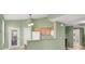 Cozy kitchen area with granite countertops, light wood cabinets, and access to the outside at 10001 Peace Way # 2277, Las Vegas, NV 89147
