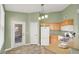 Bright, open kitchen featuring a breakfast bar, modern appliances, and outside access at 10001 Peace Way # 2277, Las Vegas, NV 89147