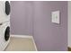 Laundry room with stacked washer and dryer for convenient space saving at 10001 Peace Way # 2277, Las Vegas, NV 89147