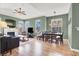 Spacious living room features laminate flooring, a fireplace, and large windows for natural light at 10001 Peace Way # 2277, Las Vegas, NV 89147
