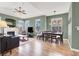Spacious living room features laminate flooring, a fireplace, and large windows for natural light at 10001 Peace Way # 2277, Las Vegas, NV 89147