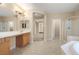 Primary bathroom with double sink vanity, shower, and separate soaking tub at 10013 Scenic Walk Ave, Las Vegas, NV 89149