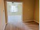 Spacious bedroom with plush carpeting, ceiling fan, and bright window views at 10013 Scenic Walk Ave, Las Vegas, NV 89149