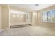 Open bonus room featuring neutral carpeting and natural light from the windows at 10013 Scenic Walk Ave, Las Vegas, NV 89149