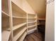 Walk-in closet featuring custom built-in shelving providing ample storage space at 10013 Scenic Walk Ave, Las Vegas, NV 89149