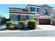 Stylish two-story home features shuttered windows, manicured landscaping, and a tile roof at 10013 Scenic Walk Ave, Las Vegas, NV 89149