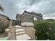 Beautiful home featuring desert landscaping, stone accents, and an ADT security system sign at 10013 Scenic Walk Ave, Las Vegas, NV 89149