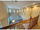 Bright, two-story foyer showcasing an open floor plan with hardwood flooring and decorative wall insets at 10013 Scenic Walk Ave, Las Vegas, NV 89149