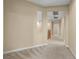 Spacious carpeted hallway with neutral walls and recessed lighting creates a bright and inviting path through the home at 10013 Scenic Walk Ave, Las Vegas, NV 89149