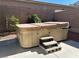 Relaxing backyard hot tub with convenient steps, perfect for unwinding in a private outdoor oasis at 10013 Scenic Walk Ave, Las Vegas, NV 89149