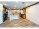 Modern kitchen with stainless steel appliances, wood cabinets, and an expansive island perfect for entertaining at 10013 Scenic Walk Ave, Las Vegas, NV 89149