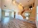 Spacious living room featuring hardwood floors, abundant natural light, and an open layout at 10013 Scenic Walk Ave, Las Vegas, NV 89149