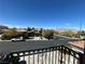 View from a balcony showing the street, front yard, and neighborhood at 10013 Scenic Walk Ave, Las Vegas, NV 89149