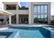 Stunning backyard pool with spa and covered outdoor living area at 10756 Steel Ridge Ct, Las Vegas, NV 89135