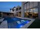 Contemporary home design with luxurious backyard pool and lounge chairs at 10756 Steel Ridge Ct, Las Vegas, NV 89135
