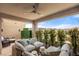 Relaxing covered balcony with comfortable seating and lovely neighborhood views at 10756 Steel Ridge Ct, Las Vegas, NV 89135
