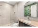 Bathroom featuring a walk-in shower with stone flooring at 10756 Steel Ridge Ct, Las Vegas, NV 89135