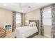 Cozy bedroom with neutral tones and a decorative chair at 10756 Steel Ridge Ct, Las Vegas, NV 89135