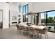 Elegant dining area with modern lighting and an open layout leading to the patio at 10756 Steel Ridge Ct, Las Vegas, NV 89135