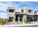 Contemporary two-story home featuring modern design, neutral color palette, and well-maintained landscaping at 10756 Steel Ridge Ct, Las Vegas, NV 89135
