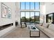 Cozy living room with a fireplace, modern furniture, and an inviting atmosphere at 10756 Steel Ridge Ct, Las Vegas, NV 89135
