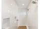 Bright walk-in shower featuring dual showerheads and white tiling at 10756 Steel Ridge Ct, Las Vegas, NV 89135