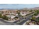 A serene residential neighborhood with neat landscaping, gated entrance, and scenic mountain views at 10980 Ampus Pl, Las Vegas, NV 89141