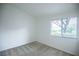 Cozy bedroom featuring neutral tones and a window for natural light at 10980 Ampus Pl, Las Vegas, NV 89141