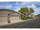 Lovely single-story home featuring a spacious two-car garage, beautiful landscaping, and manicured front yard at 10980 Ampus Pl, Las Vegas, NV 89141