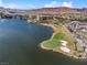An aerial view showing waterfront homes, a golf course, and the serene lake in Lake Las Vegas at 12 Tatahatso Point St, Henderson, NV 89011