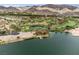 Stunning lakefront home features private dock and scenic mountain and golf course views at 12 Tatahatso Point St, Henderson, NV 89011