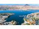 Breathtaking aerial view of Lake Las Vegas, highlighting waterfront homes, a marina, and scenic mountain backdrop at 12 Tatahatso Point St, Henderson, NV 89011
