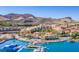 Aerial view of beautiful community with desert mountain views, water access, boats and multi-story buildings at 12 Tatahatso Point St, Henderson, NV 89011