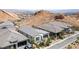 An aerial view showcases multiple homes with desert landscaping in a beautiful community at 12 Tatahatso Point St, Henderson, NV 89011