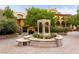 Tranquil courtyard with decorative fountain, lush greenery, and inviting ambiance at 12 Tatahatso Point St, Henderson, NV 89011