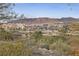 Expansive view overlooking a waterway with buildings, bridges, and mountains in the distance at 12 Tatahatso Point St, Henderson, NV 89011