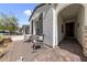 Inviting front porch with seating area, covered entryway, and beautiful stone accents at 12 Tatahatso Point St, Henderson, NV 89011