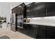 Well-appointed kitchen with stainless steel refrigerator and built-in oven at 12 Tatahatso Point St, Henderson, NV 89011