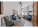 Inviting living room with seating area, decorative rug, and modern decor at 12 Tatahatso Point St, Henderson, NV 89011
