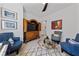 Comfortable living area with decorative furniture, artwork, and wood floors at 12 Tatahatso Point St, Henderson, NV 89011