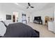 Contemporary main bedroom featuring a ceiling fan, an entertainment center, and walk-in closet at 12 Tatahatso Point St, Henderson, NV 89011