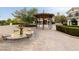 Charming outdoor space featuring a decorative gazebo, fountain, and brick-paved walkway at 12 Tatahatso Point St, Henderson, NV 89011
